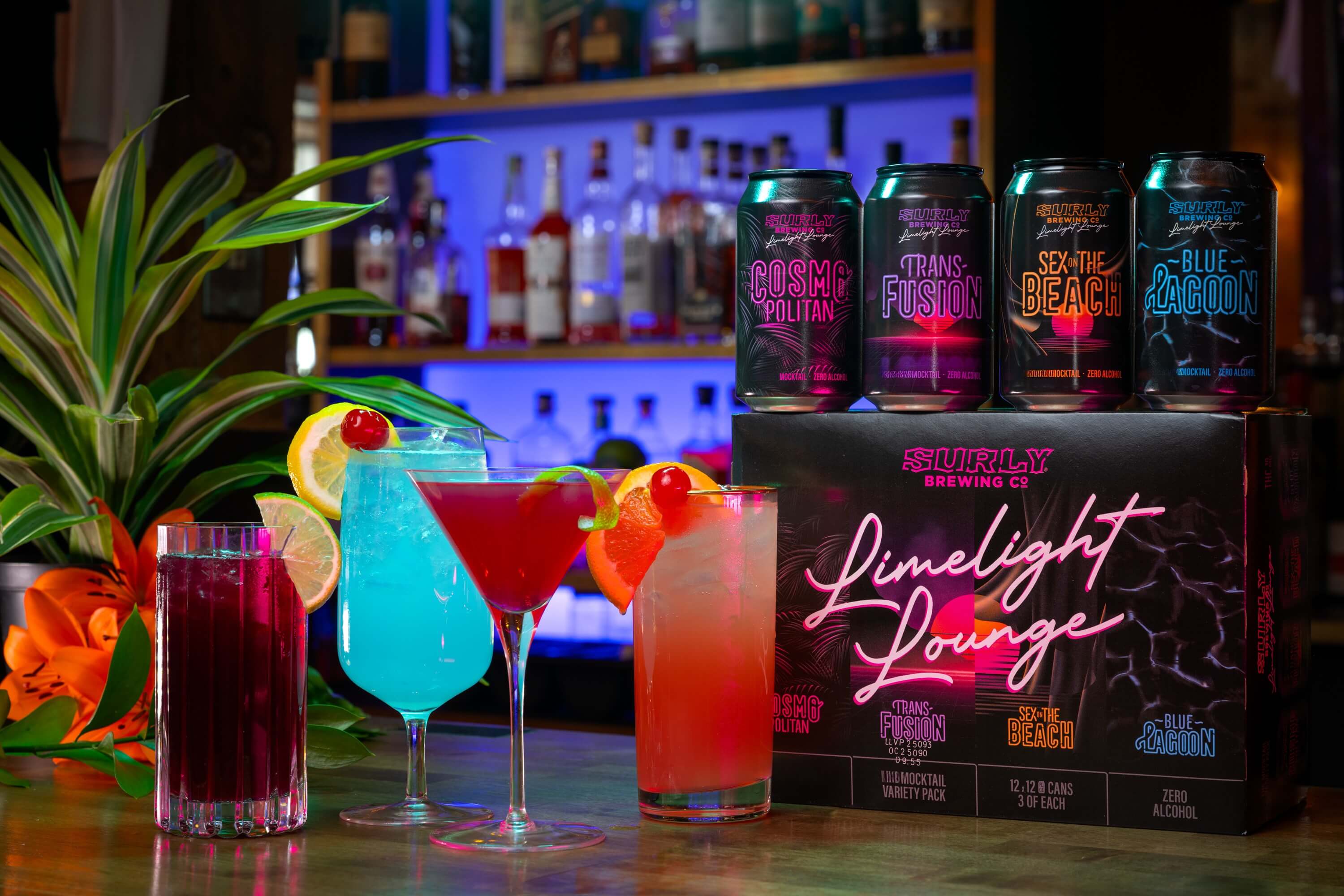 Limelight 12 pack box with four cocktails on a tropical bar top
